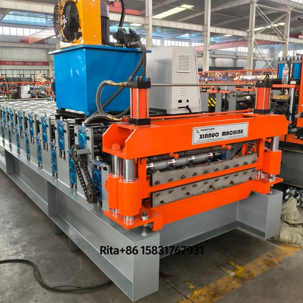 Machine main body showing robust steel frame and dual-layer roller system for simultaneous roof and wall panel production