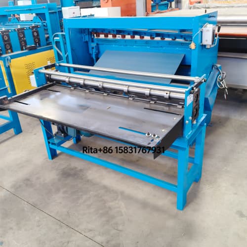 Slitting machine left side view showing material feeding system and guide rollers