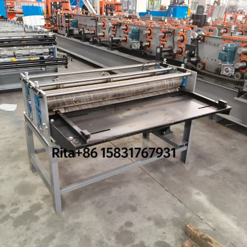 Slitting machine right side view displaying blade assembly and strip output section