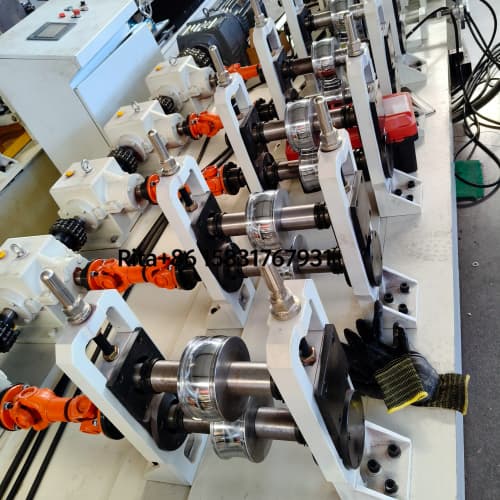 Close-up detail view of PU roller shutter door machine precision rollers and forming stations